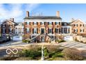 Grand brick manor house showcasing architectural details and landscaping at 4601 N Legacy Dr, Muncie, IN 47304