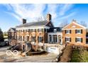 Brick manor house with multiple wings and a grand entrance at 4601 N Legacy Dr, Muncie, IN 47304