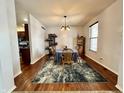 Bright dining room featuring hardwood floors and a stylish chandelier at 5876 Sunnyvale Dr, Bargersville, IN 46106