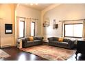 Spacious living room with hardwood floors, two sofas, and large windows at 7571 S County Road 825 E, Plainfield, IN 46168