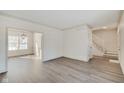 Open living space with hardwood floors and views into dining area at 7891 Tufton Ct, Fishers, IN 46038