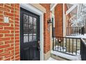 Black front door and brick entryway of townhouse at 1056 Reserve Way, Indianapolis, IN 46220