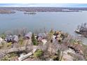 Aerial view showcasing the home's waterfront location and proximity to the lake at 10901 Brigantine Dr, Indianapolis, IN 46256