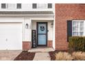 Front entrance with a welcoming sign and landscaping at 1225 Spring Lake Dr, Brownsburg, IN 46112