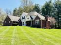 Elegant two-story home with brick details and a large, well-maintained lawn at 125 Chalet Dr, Mooresville, IN 46158