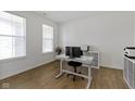Well-lit home office with large windows, neutral decor, and modern furnishings at 1271 Clairet Dr, Westfield, IN 46074