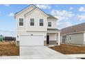 Charming two-story home with a two car garage and manicured front lawn at 1845 James Pierce Dr, Shelbyville, IN 46176