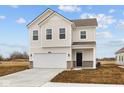 Charming two-story home with a two car garage and manicured front lawn at 1845 James Pierce Dr, Shelbyville, IN 46176