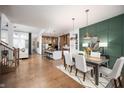 Open concept kitchen with island, stainless steel appliances, and hardwood floors at 20027 Old Dock Rd, Westfield, IN 46074