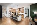 Modern kitchen with an island, stainless steel appliances, and light wood cabinets at 20027 Old Dock Rd, Westfield, IN 46074