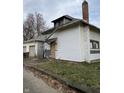White house needing repairs, brick chimney at 2364 Shelby St, Indianapolis, IN 46203