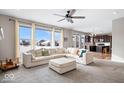 Open living room with a view of the kitchen and large windows at 2449 Lingerman Way, Avon, IN 46123