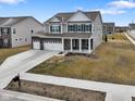 Well-kept two-story home featuring a three-car garage, pristine landscaping, and a welcoming front porch at 4201 Risen Star Way, Bargersville, IN 46106