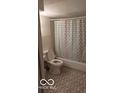 Clean bathroom with shower/tub and patterned tile floor at 5414 E 11Th St, Indianapolis, IN 46219