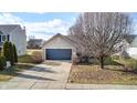 Home with a two car garage at 5620 Thompson Park Blvd, Indianapolis, IN 46237
