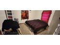Spacious bedroom with dark-colored bedding and carpeted floor at 1313 S Riley Ave, Indianapolis, IN 46203