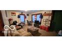 Cozy living room featuring a sofa, TV, and ample natural light at 1313 S Riley Ave, Indianapolis, IN 46203