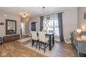 Bright dining area with table, chairs, and hardwood floors at 4062 Hunt Club Pkwy, Bargersville, IN 46106