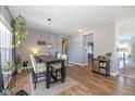 Open concept dining area with hardwood floors and kitchen view at 4062 Hunt Club Pkwy, Bargersville, IN 46106