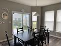 Kitchen dining area with a large table and sliding glass doors to the backyard at 5126 Sagebrook Blvd, Indianapolis, IN 46239