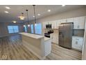 Modern white kitchen with stainless steel appliances at 841 Udell St, Indianapolis, IN 46208