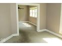 Bright living room featuring neutral walls, ample natural light, and a spacious open floor plan at 1138 W 33Rd St, Indianapolis, IN 46208