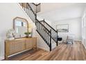 Bright entryway with hardwood floors and staircase at 13172 Antonia Blvd, Carmel, IN 46074