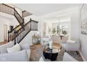 Spacious living room with seating area and hardwood floors at 13172 Antonia Blvd, Carmel, IN 46074