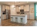 Spacious kitchen featuring white cabinets, a large island, and stainless steel appliances at 17242 Cole Evans Dr, Noblesville, IN 46060