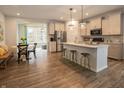 Open concept kitchen with island seating, stainless steel appliances, and breakfast nook at 17242 Cole Evans Dr, Noblesville, IN 46060