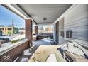 Covered porch with brick columns and space for seating at 2957 Winthrop Ave, Indianapolis, IN 46205