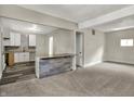Inviting open-concept living room with kitchen featuring modern countertops and flooring at 35 S Catherwood Ave, Indianapolis, IN 46219