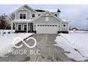 Two-story house with gray siding, white trim, and a three-car garage at 4103 Railhead Ave, Westfield, IN 46074