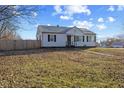 Quaint home with a fenced yard offering privacy and curb appeal at 6471 Homestead Dr, Indianapolis, IN 46227