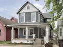 Two-story gray house with white trim and a front porch at 730 Sanders St, Indianapolis, IN 46203