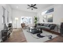 Spacious living room with hardwood floors and large windows at 730 Sanders St, Indianapolis, IN 46203