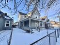 Two-story house with front porch, viewed from across the street at 78 N Belleview Pl, Indianapolis, IN 46222