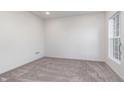 Spacious bedroom with neutral-colored carpet and large window at 1836 Blenker Dr, Carmel, IN 46032