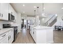 Modern kitchen with white cabinets, stainless steel appliances, and an island at 18920 Seaforth Way, Westfield, IN 46074