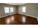 Bright bedroom with hardwood floors and neutral walls at 2116 N Rosewood Ave, Muncie, IN 47304