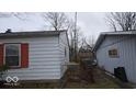 Side view of the house showcasing additional exterior features at 2435 N Eaton Ave, Indianapolis, IN 46219