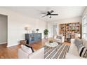 Bright living room with hardwood floors, comfortable seating, and built-in shelves at 2521 Cicero Rd, Noblesville, IN 46060