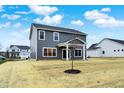 Two-story house with backyard and a covered patio at 4070 Railhead Ave, Westfield, IN 46074