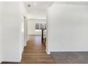 Hallway with hardwood floors leading to the staircase at 4070 Railhead Ave, Westfield, IN 46074