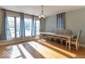 Bright dining room with hardwood floors and large windows at 502 W 38Th St, Indianapolis, IN 46208