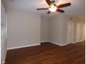 Hardwood floor living room with neutral walls and ceiling fan at 513 N Park Ave, Indianapolis, IN 46202