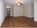 Spacious living room with hardwood floors and ceiling fan at 513 N Park Ave, Indianapolis, IN 46202