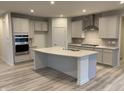 Spacious kitchen with light gray cabinets, quartz countertops, and stainless steel appliances at 5505 Noble Crossing W Pkwy, Noblesville, IN 46062