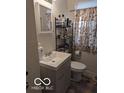 Small bathroom with updated vanity and mirror at 5708 N Keystone Ave, Indianapolis, IN 46220