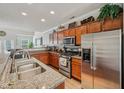 Well-equipped kitchen featuring stainless steel appliances, granite countertops, and ample cabinet space at 6595 Reserve Dr, Indianapolis, IN 46220